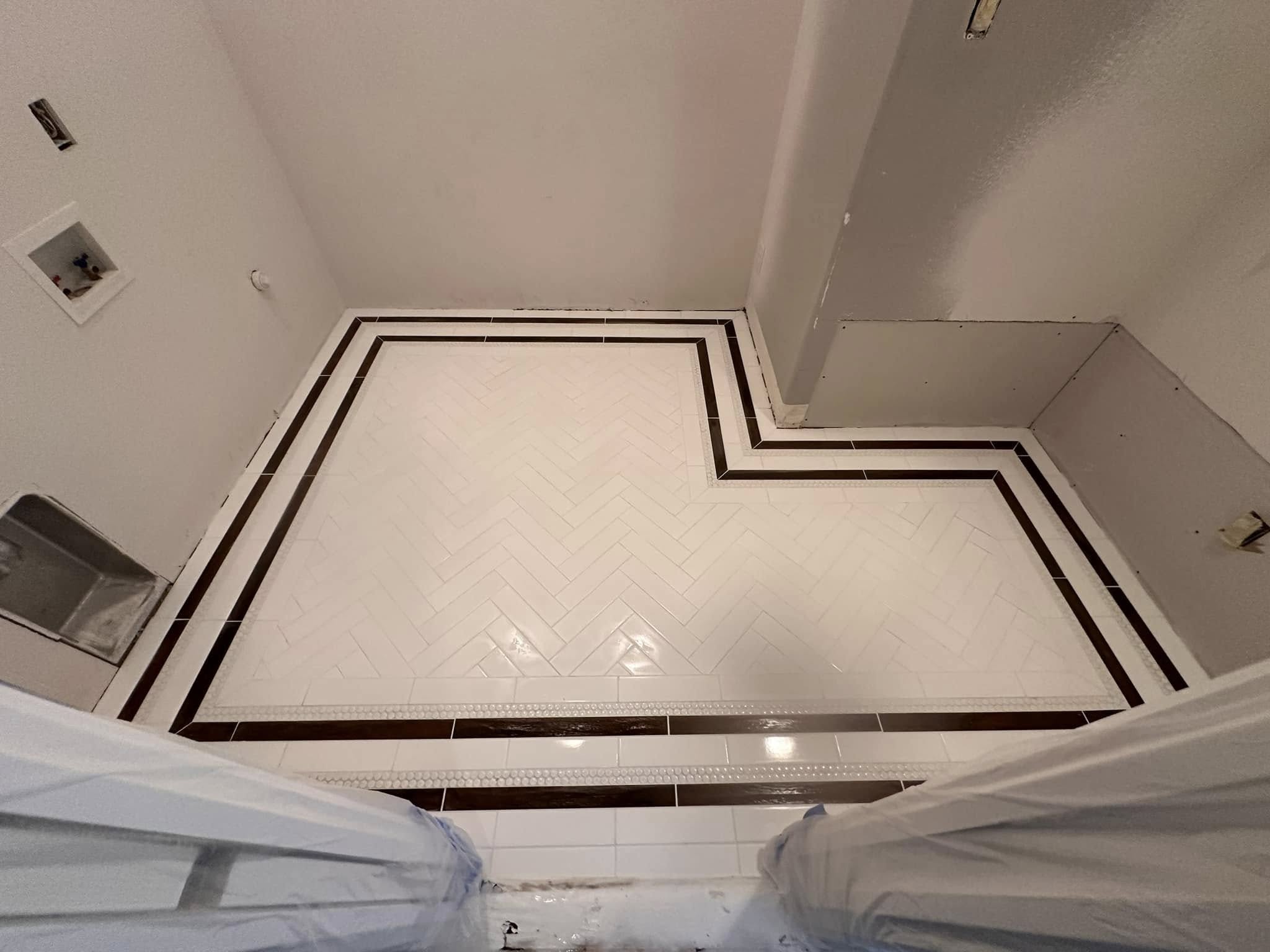 Floor installation with herringbone pattern and dark border
